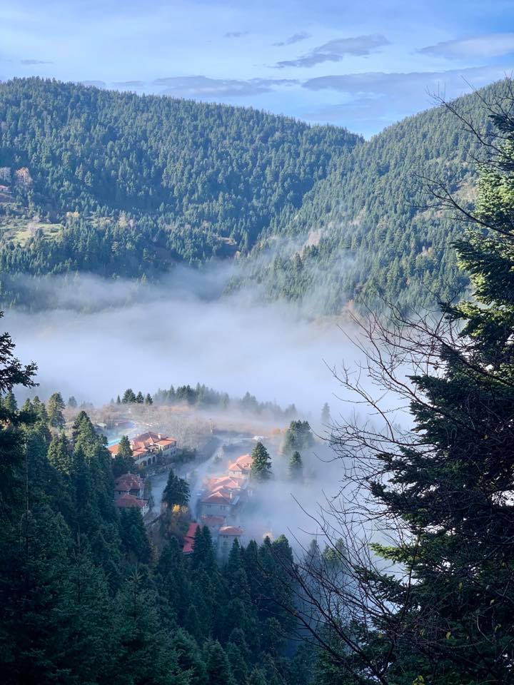 Fog moving between the mountains above the lake